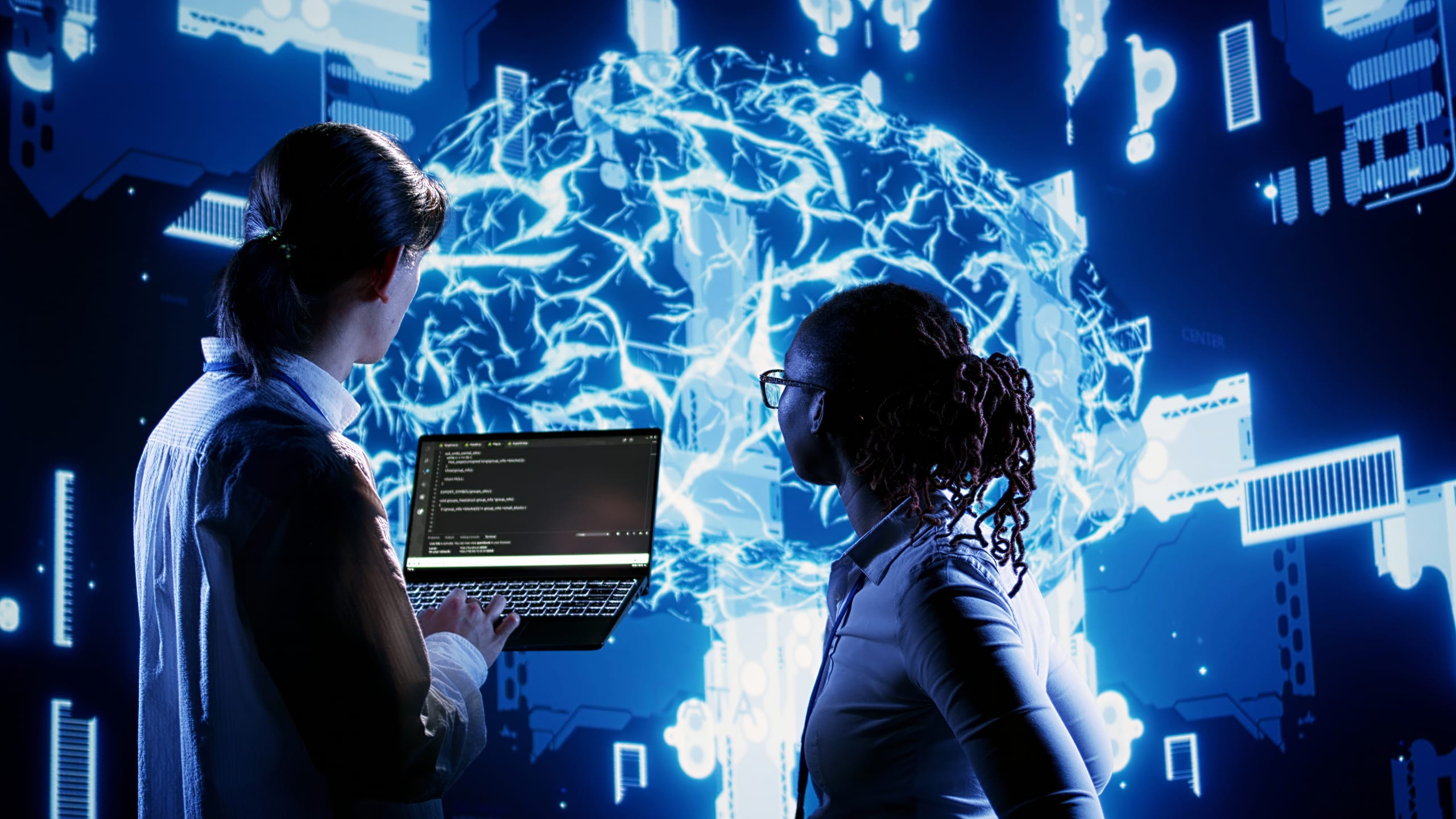 Two engineers reviewing a live cloud infrastructure visualisation